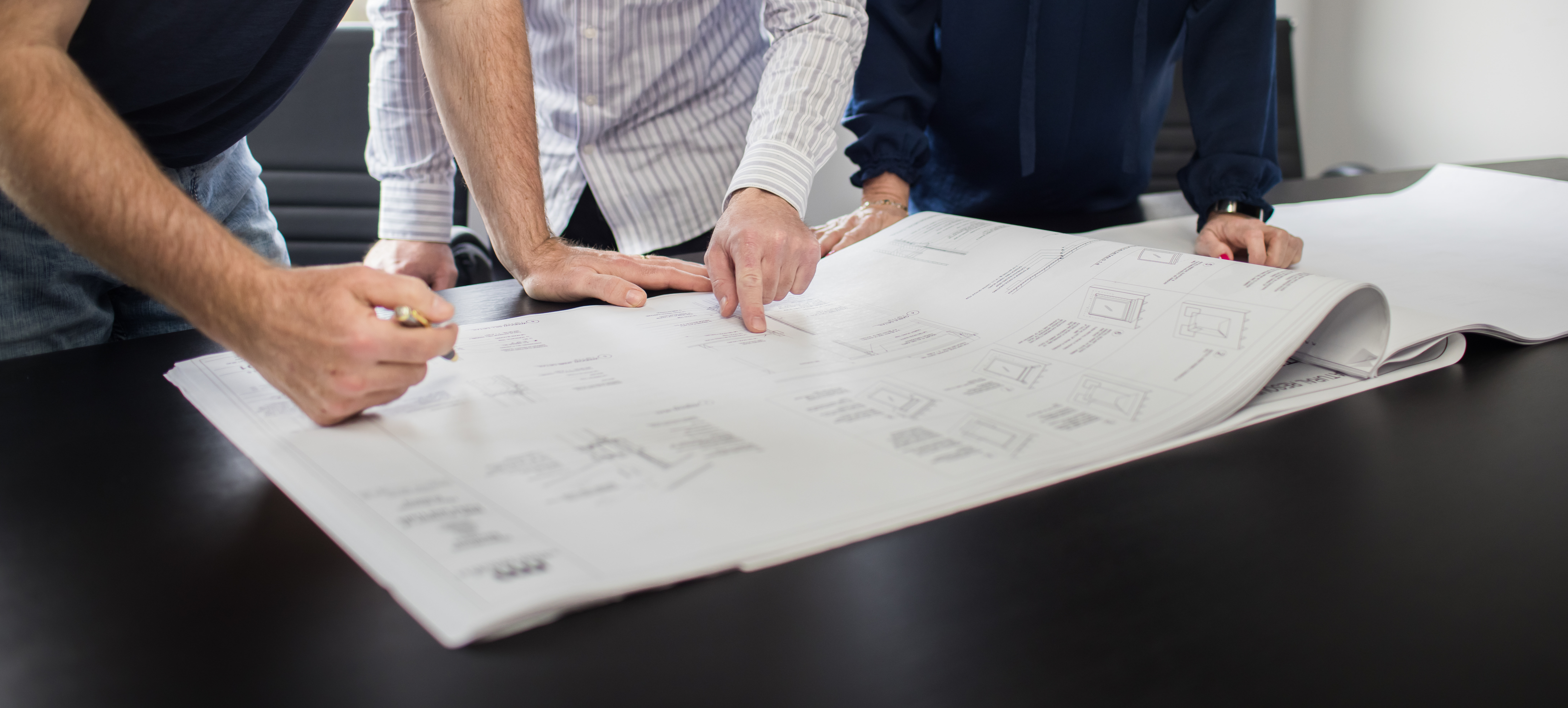 Jorgenson Construction Preconstruction team reviewing drawings